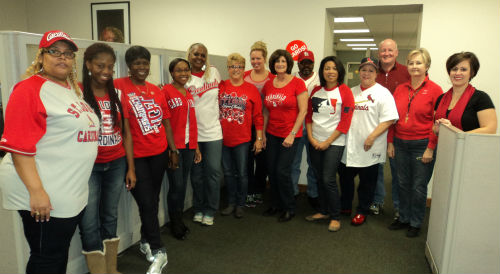 Collector of Revenue Earnings Tax Division employees show their support for the St. Louis Cardinals during their race for the World Series title.