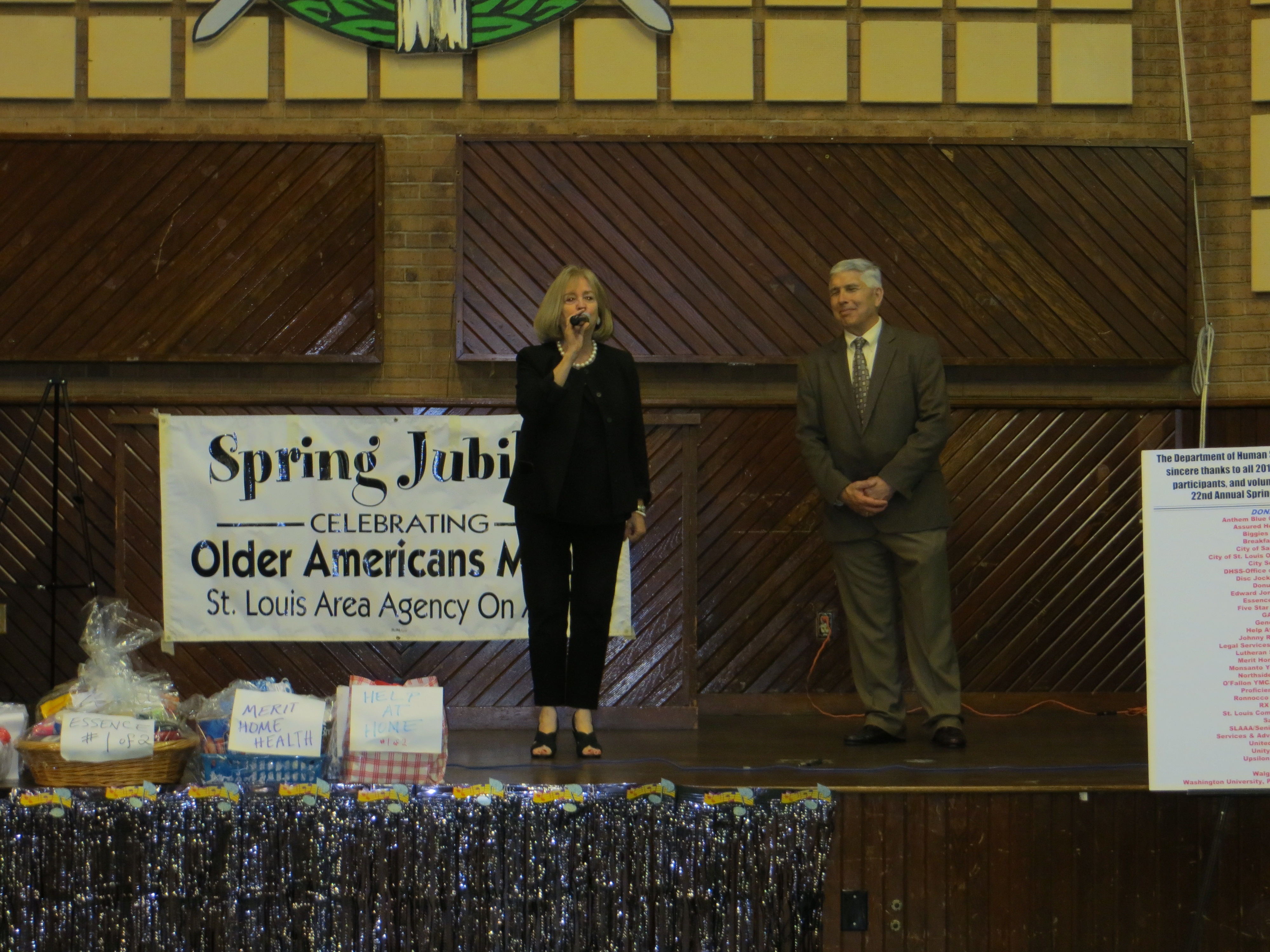 David Sykora of the St. Louis Area Agency on Aging looks on as Mayor Lyda Krewson addresses the audience at the annual Spring Jubilee.