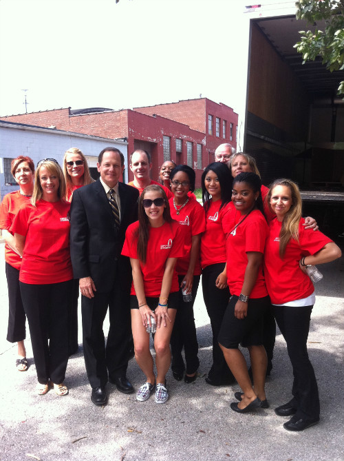 Mayor Francis G. Slay poses with Lumiere Place team members at AmeriCorps St. Louis.