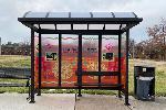 A bus shelter rendering with an orange background, geometric shapes and words that say 'HOPE ENDURES'