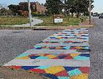 Crosswalk 3: stained-glass-like color blocks that are yellow, blue, turquoise and red.