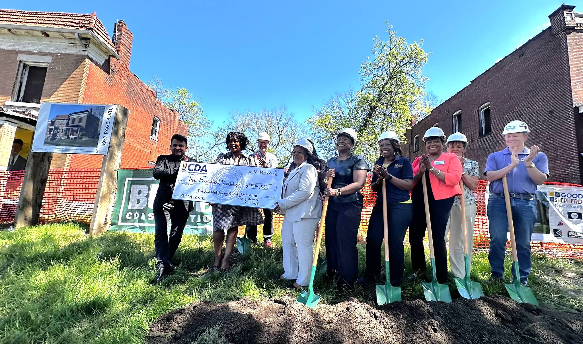 People and staff at groundbreaking ceremony and ceremonial check for Good Shepard