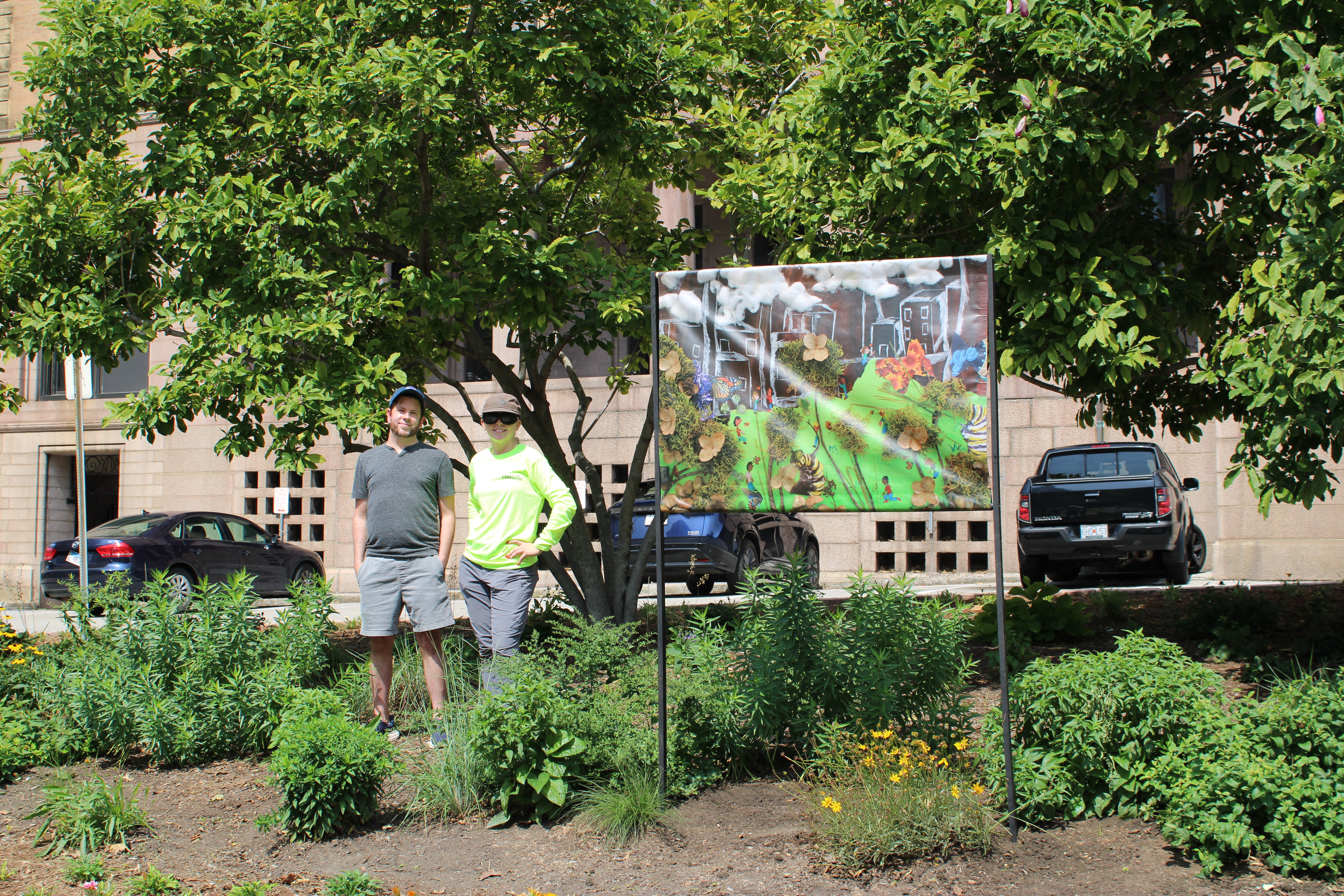 Anderson and Dasenbrock pose with a freshly mounted mural