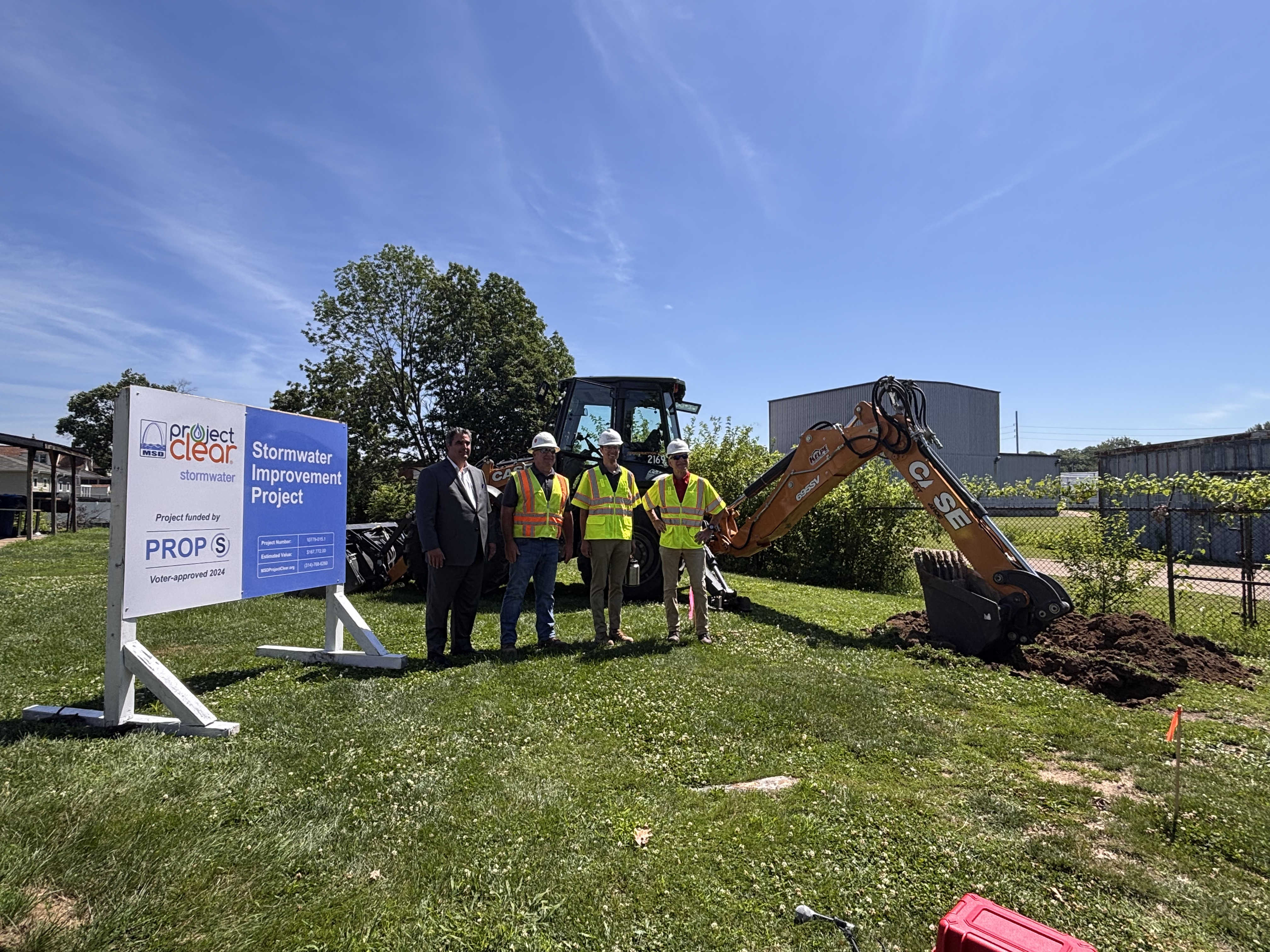 Metropolitan St. Louis Sewer District workers in front of site