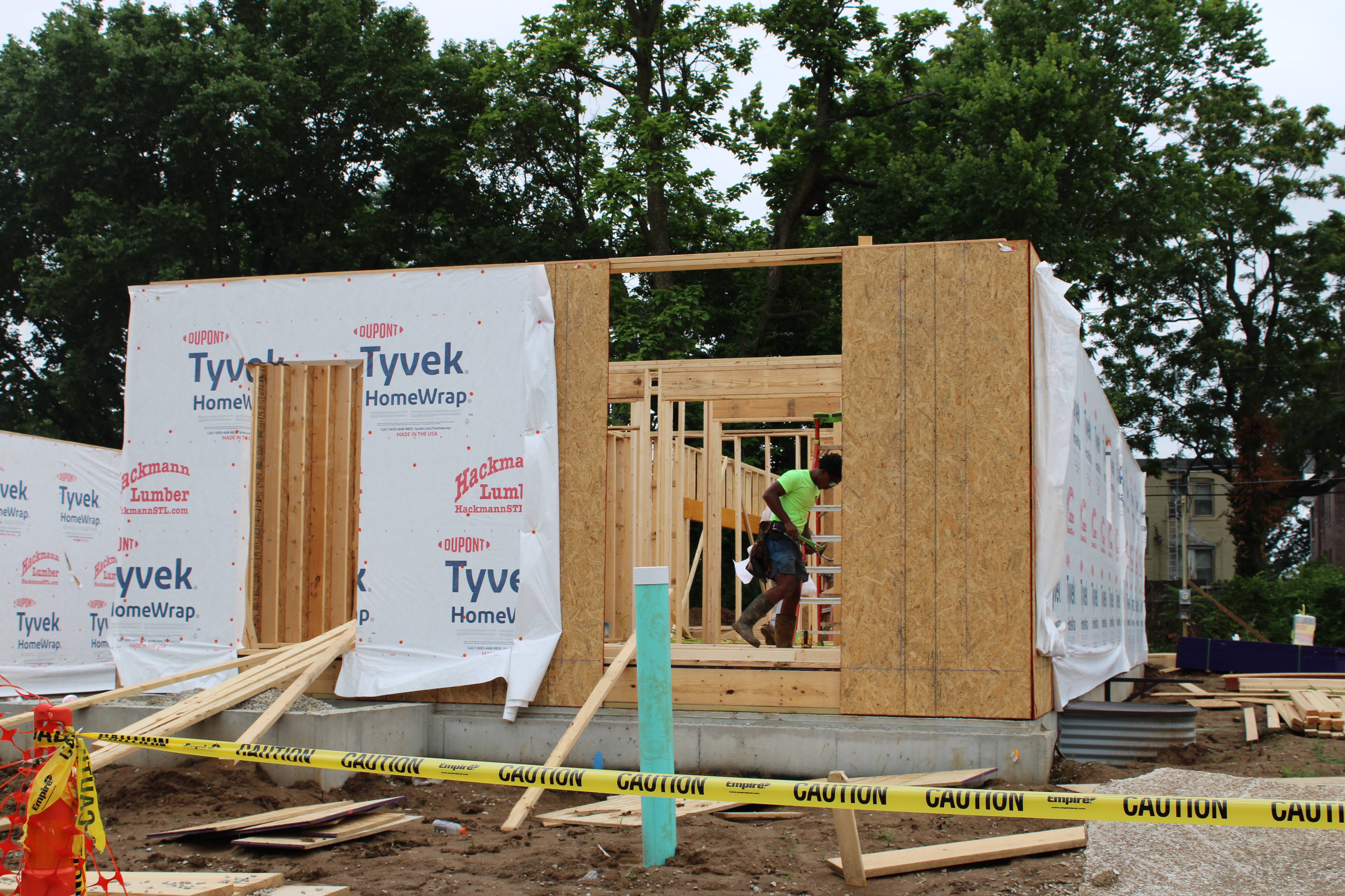 A carpenter working on homes along Vernon Avenue