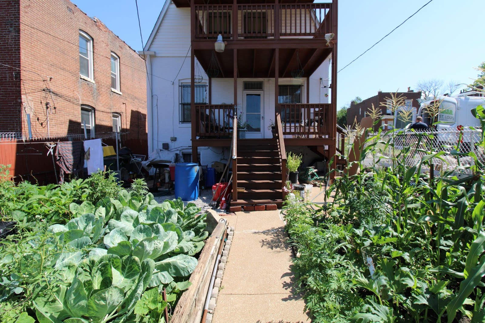 Back view of Ms. Bobbie’s home, where a newly installed grab bar provides easier access to and from her harvest ready garden. Back view of Ms. Bobbie’s home, where a newly installed grab bar provides easier access to and from her harvest ready garden.