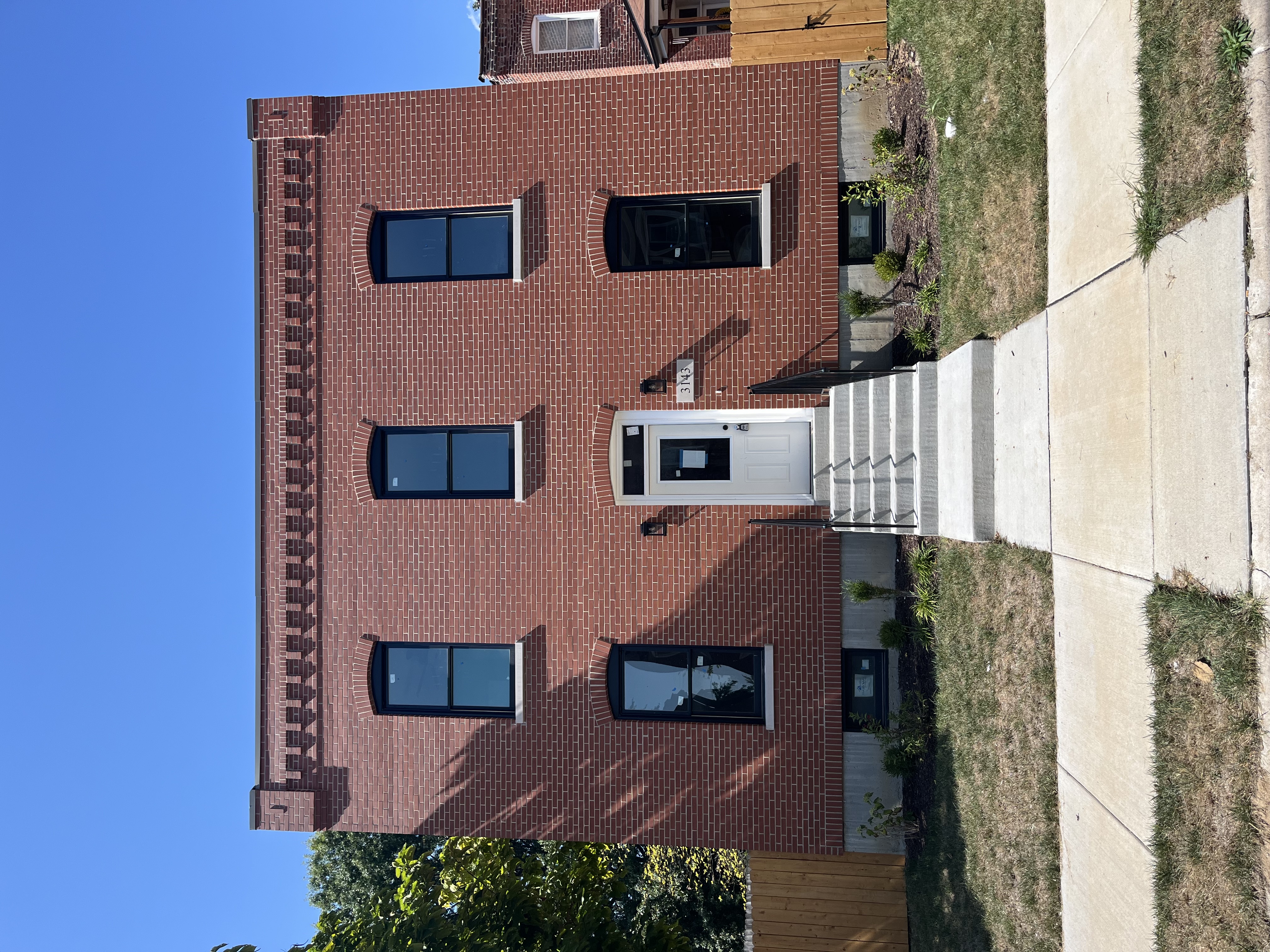 Front 3143 Ohio a brick house with two stories and white door