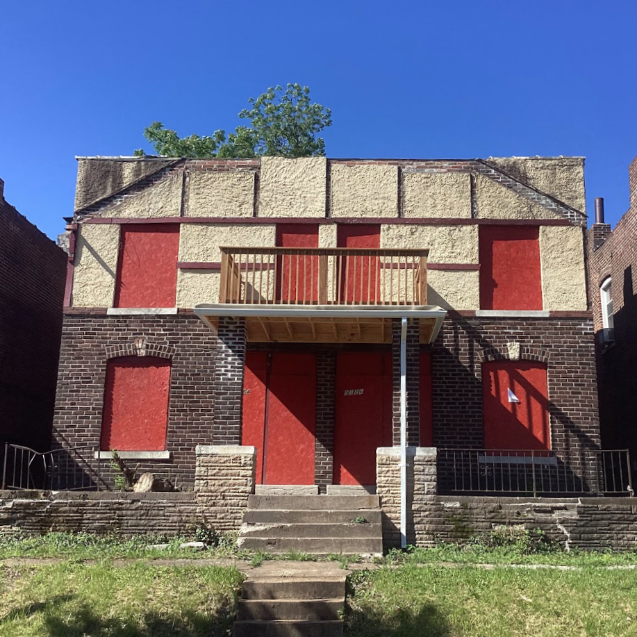 5124 Wabada Ave a two-story brick building with boarded-up windows