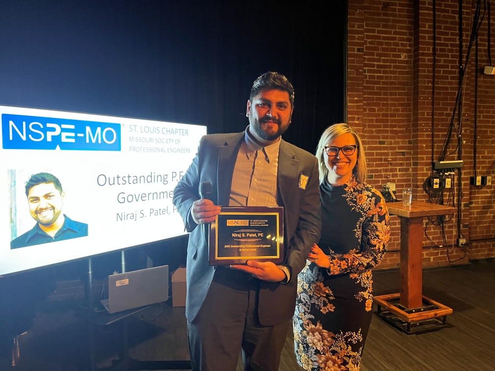 Director of Public Utilities, Niraj Patel with award.