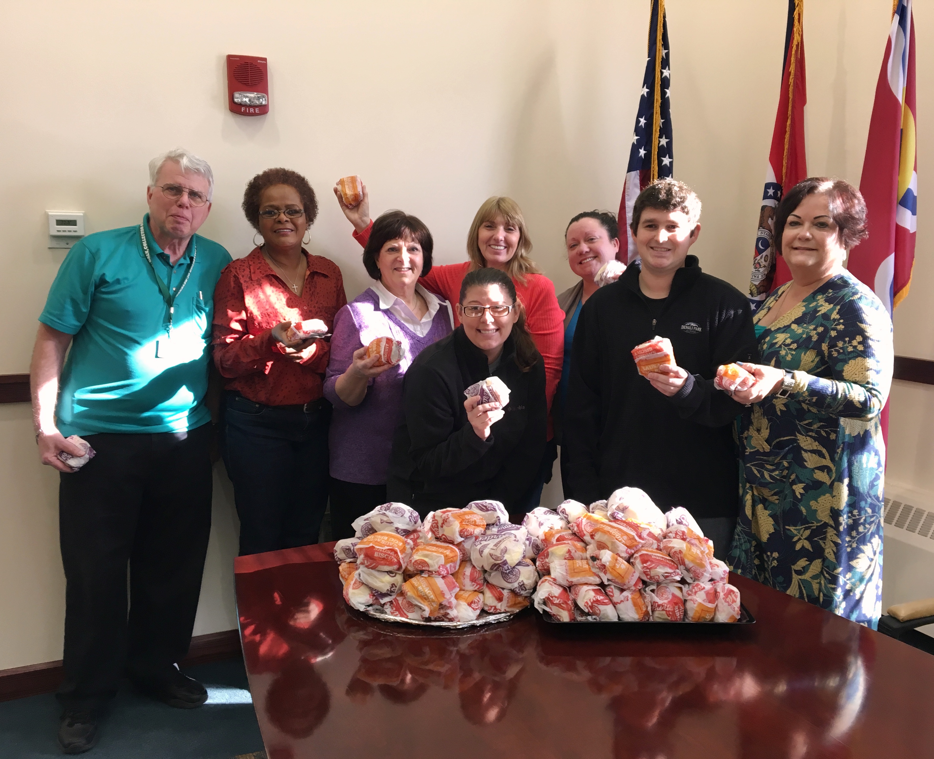 Collector of Revenue employees enjoy Hardee's biscuits in support of the annual fundraiser for Heat Up St. Louis