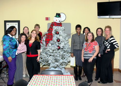 COR employees and judges pose by the Frosty entry in the 2012 Tree Decorating Contest.