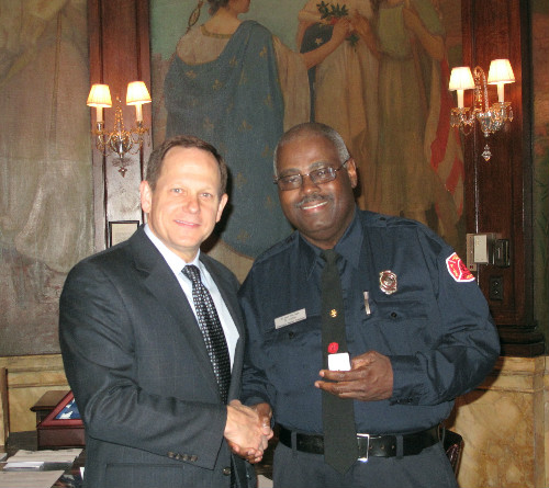 Mayor Slay presents Donald Jones with his 40-year service pin