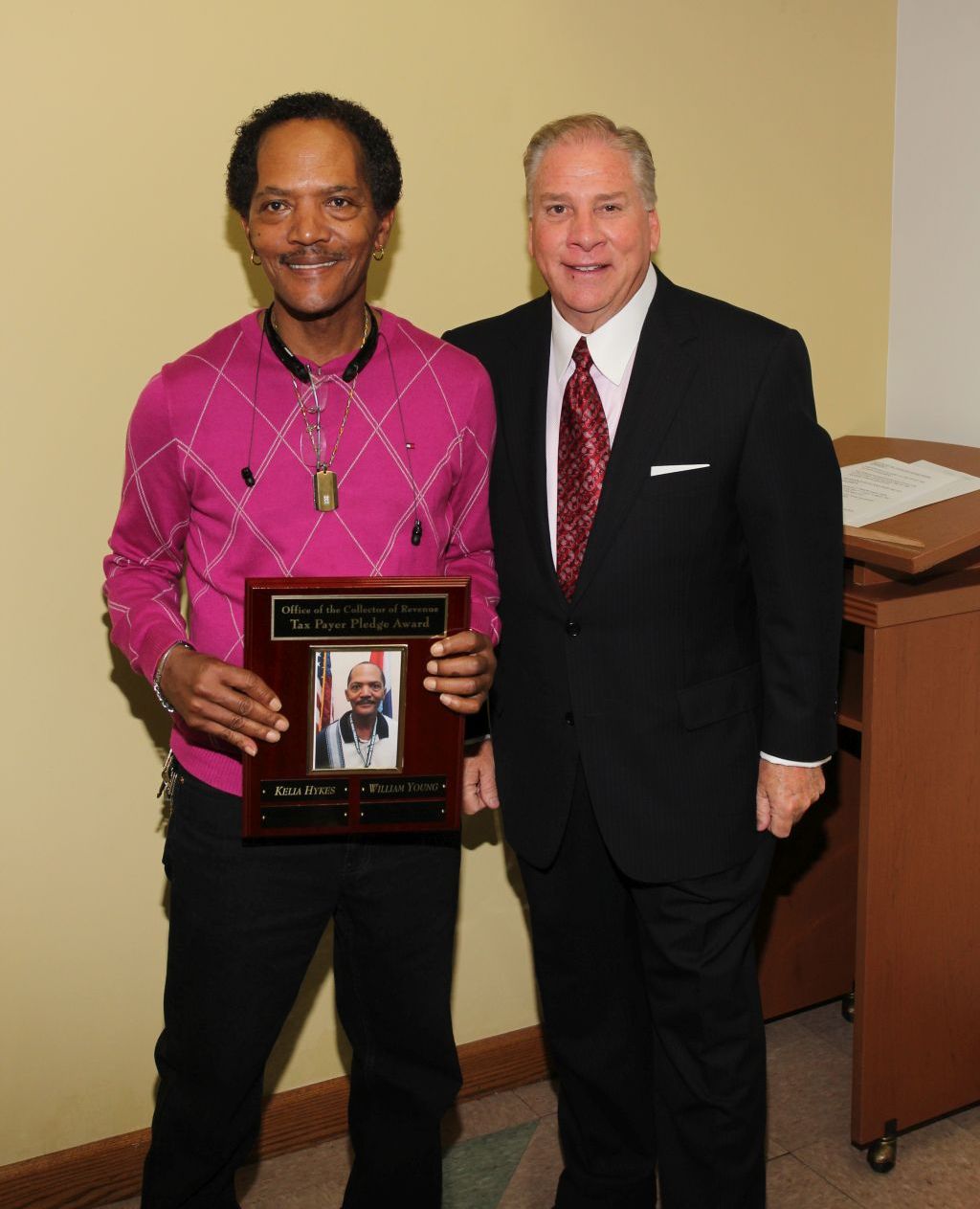 William Young receives the Taxpayer Pledge Award from Collector of Revenue Gregory F.X. Daly