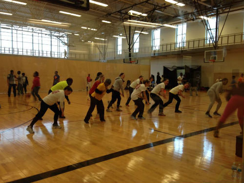 Ladies performing Zumba led by an instructor from The Dollhouse Studios at the O'Fallon Park Rec Plex.